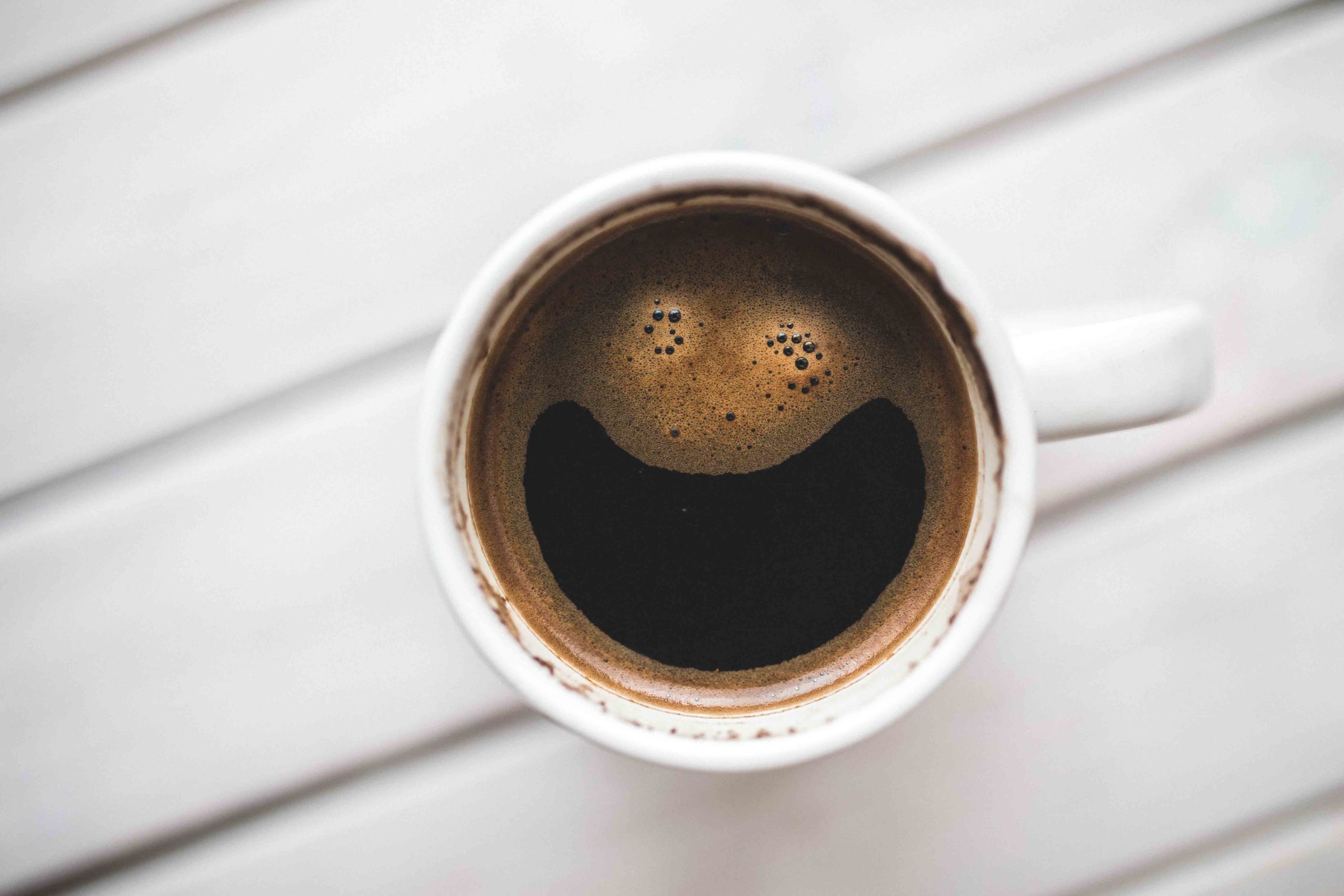 Cup of coffee with smiley face 