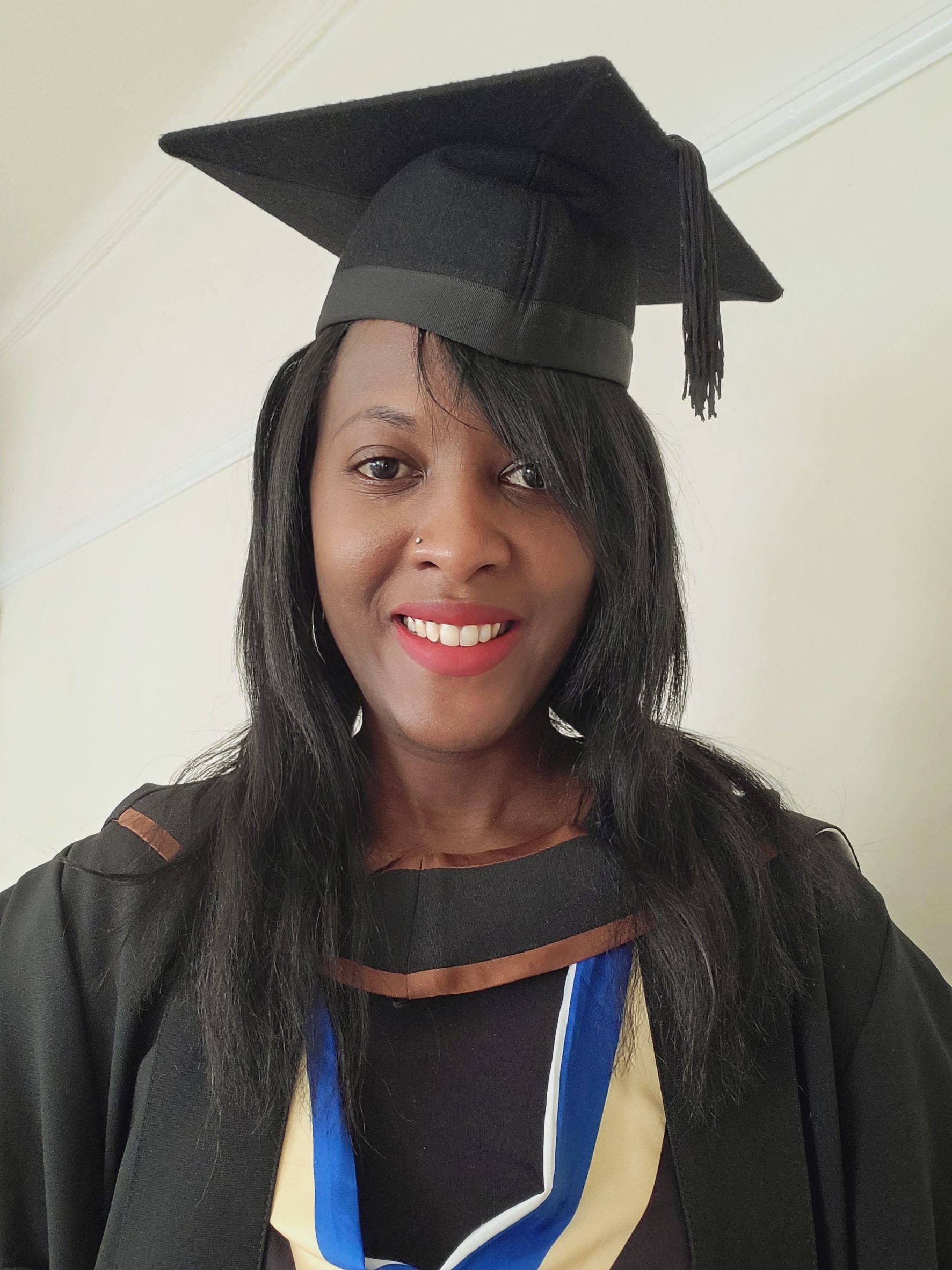 Nikesha Morris in graduation cap and gown