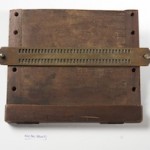 Braille writing frame as used by Dr T. R. Armitage, c. 1880. Wood and brass.